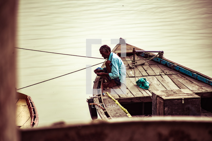 a man on a fishing boat 
