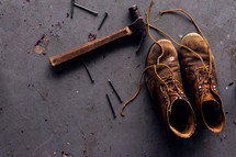 hammer, nails, and old leather boots 