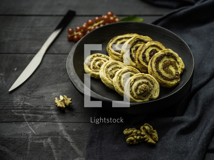 Swirl cookie treats with pecans on black