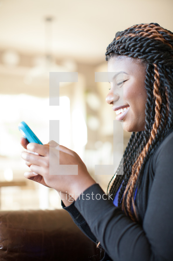 african-american woman texting on a cellphone 