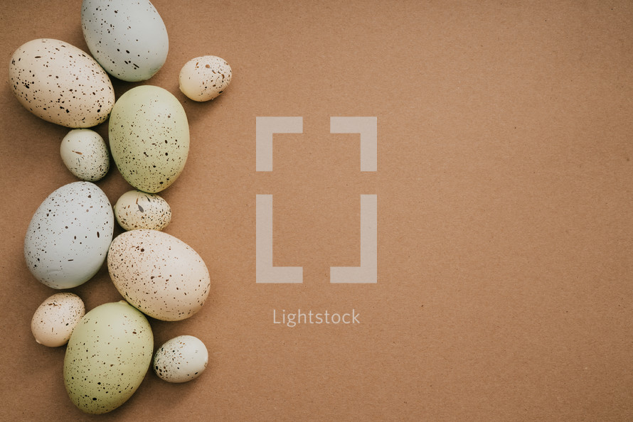 speckled Easter eggs on a brown background 