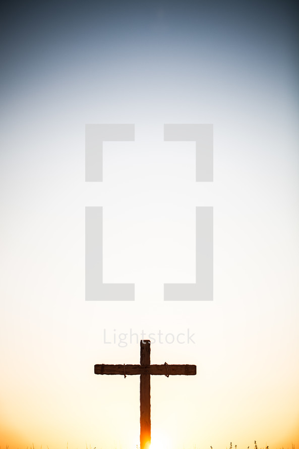Cross on the hill at sunrise.
