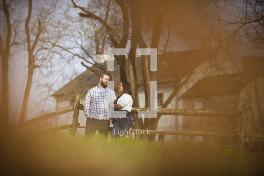out of focus image of a couple standing outdoors 