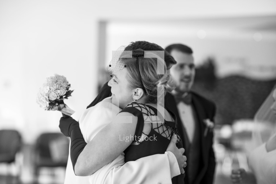 hugs at a wedding ceremony 
