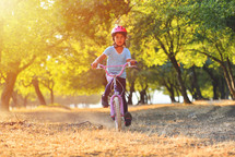 Happy child on a bike 