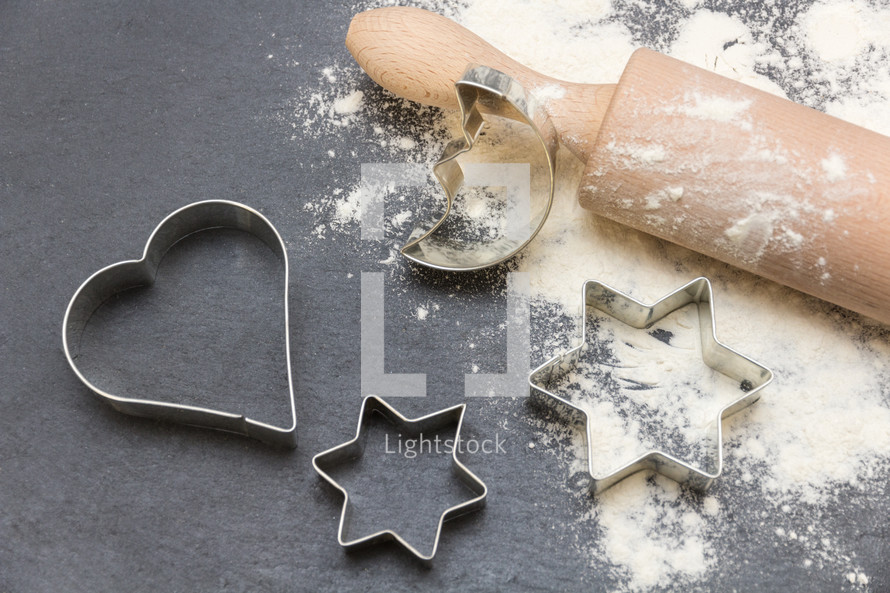 rolling pin, cookie cutters, and flour 