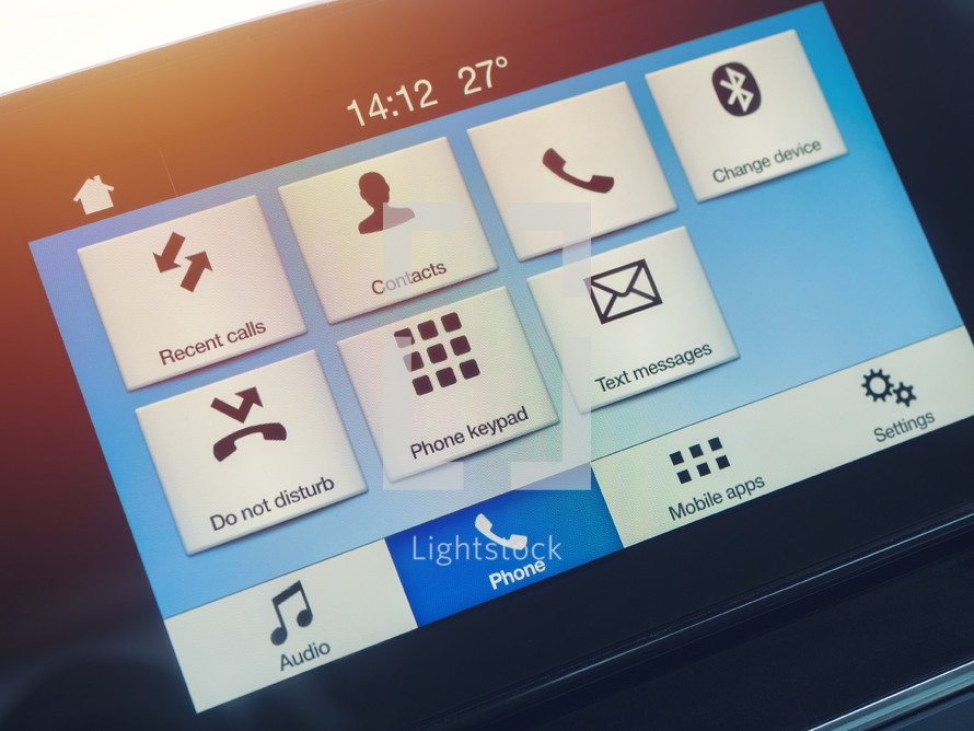 Smart multimedia in-car display with hands-free phone control. Modern navigation device on center of the car control panel.
