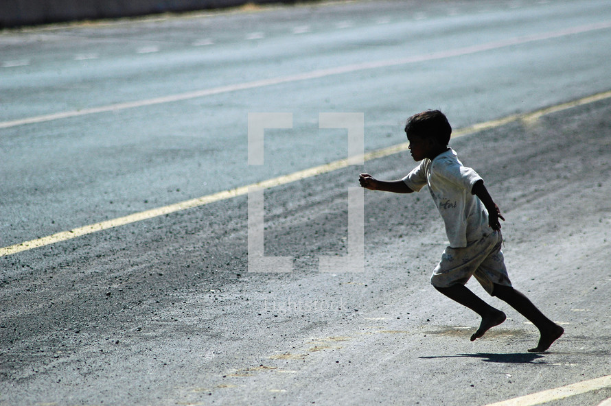 a child darting across a street 
