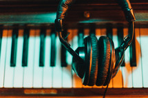 headphones on a piano 