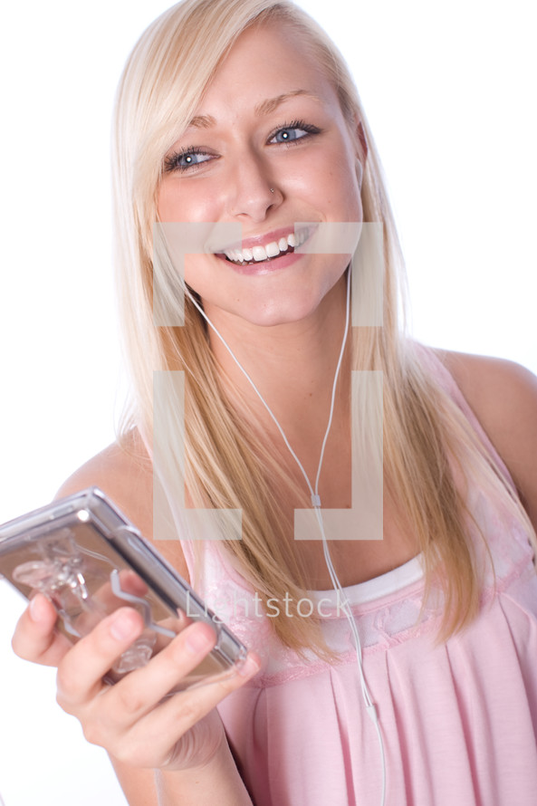 a young woman listening to music with earbuds 