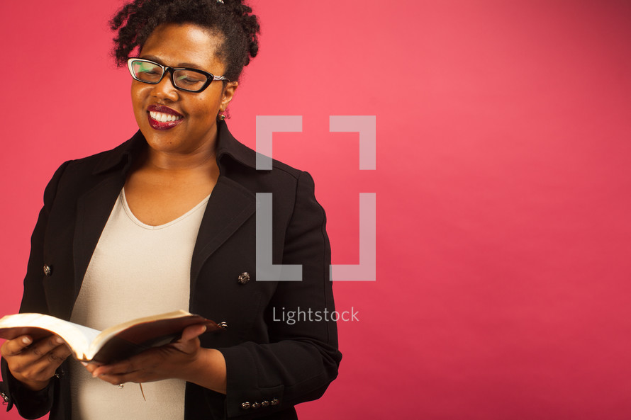 African American woman reading a Bible 