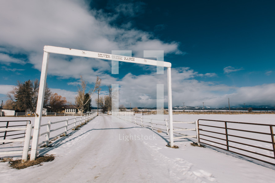 entrance to a ranch in winter 
