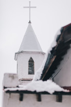 snow on a church steeple 