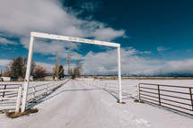 entrance to a ranch in winter 