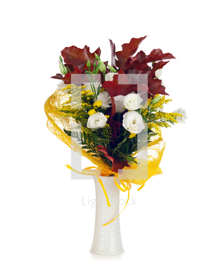 Lisianthus and autumn leaves on white background.