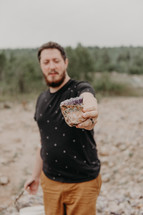 a man holding a geode 