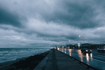 rain clouds over a wet coastal highway 
