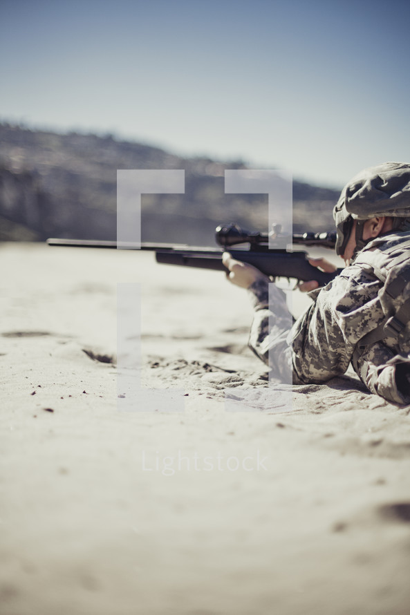 Soldier pointing rifle