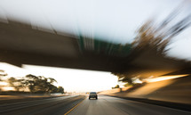 car traveling on a freeway 