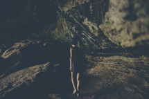 woman walking in a cave