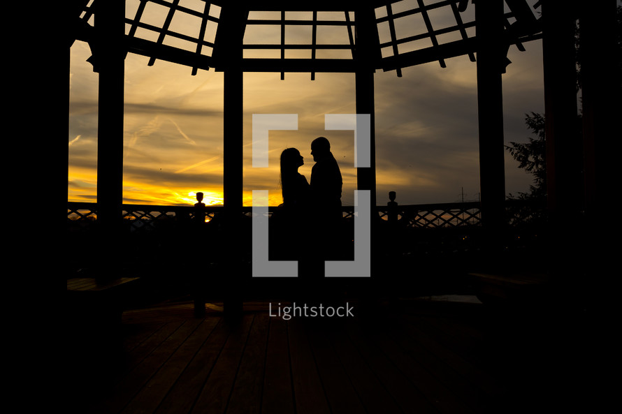 silhouette of a couple hugging