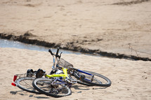 Two old bikes on the beach.