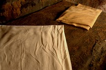 folded linens in the empty tomb