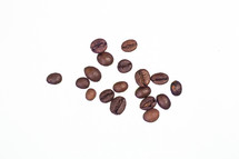 Coffee beans against a white background.