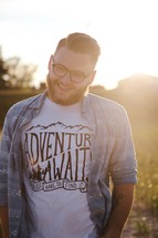 man wearing an Adventure Awaits t-shirt 