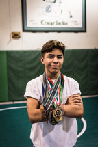 a young man with many medals 