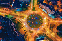 Top view of Road roundabout. Cityscape downtown at night