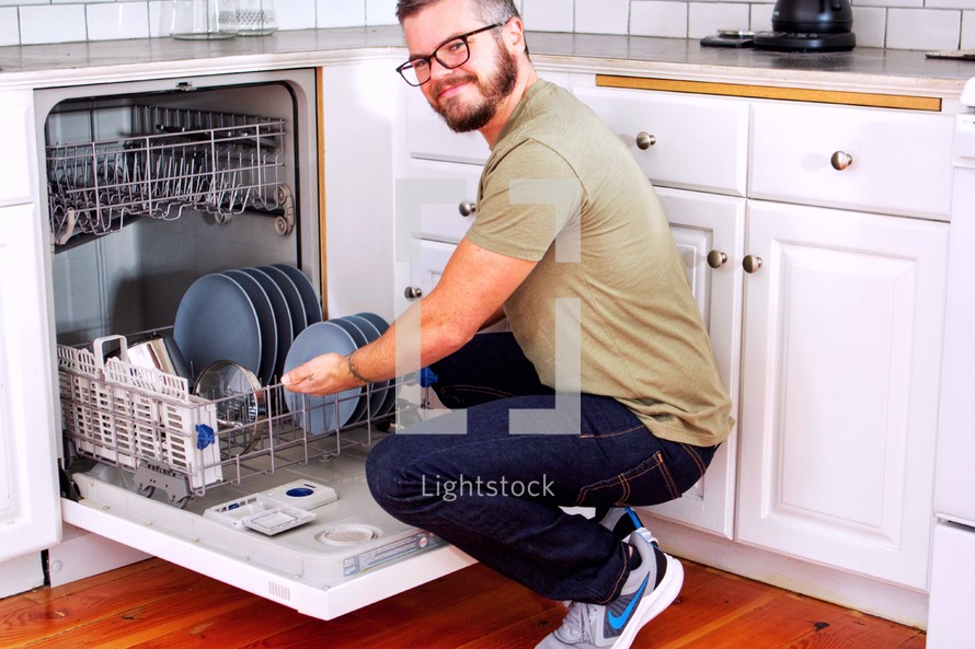 a man doing dishes 