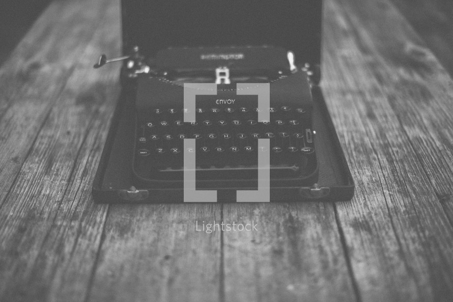 A vintage typewriter on a wooden table