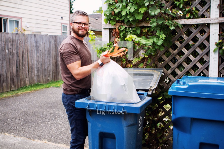 a man taking out the trash 