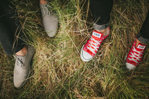 shoes and feet in the grass