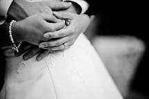 brides hands over grooms hands