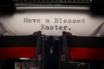 "Have a Blessed Easter " greeting typed on a vintage typewriter.