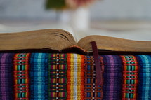 an open Bible on a blanket 