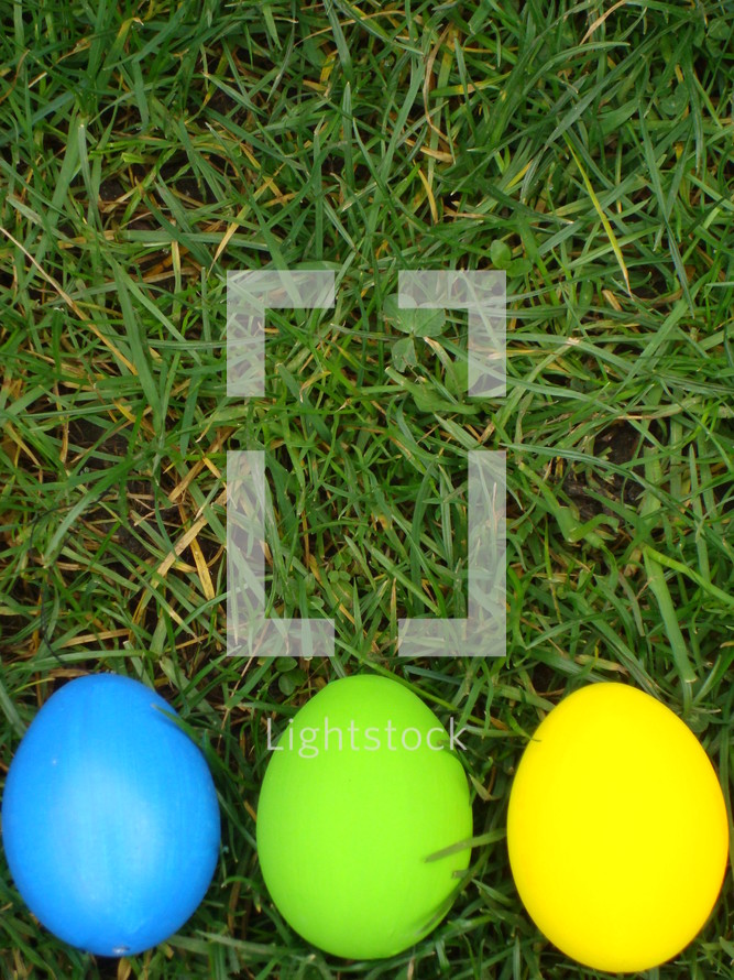 Colored Easter eggs in the grass.
