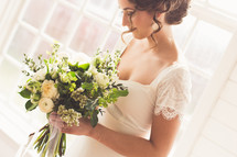 a bride holding a bridal bouquet 