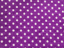 white polka dots on purple fabric 