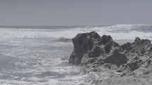 Ocean waves on a rocky shore.