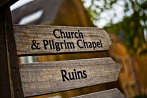 church and pilgrim chapel ruins arrows sign