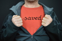 a man with the word saved on his t-shirt 