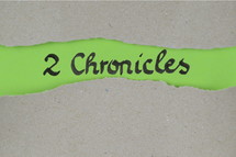 Title 2 Chronicles - torn open kraft paper over green paper with the name of the second book of Chronicles