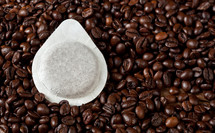 coffee pod on coffee beans 