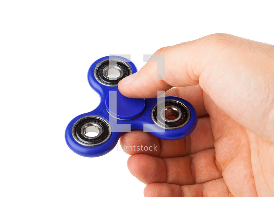 Playing with a Fidget Spinner on a white background