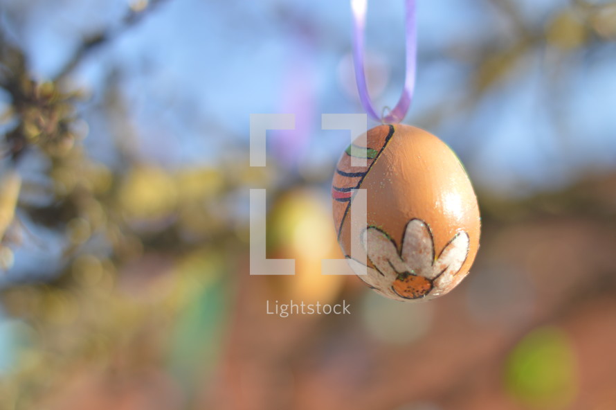 Easter eggs hanging on tree branches 