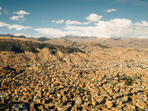 A sprawling city in the mountains.