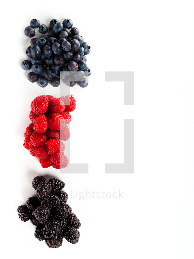 Assortment of forest fruits, rasperries, blueberries and blackberries.